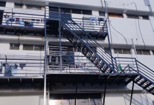 Exterior view of the migrant worker dormitories in a converted warehouse