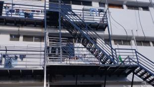 Exterior view of the migrant worker dormitories in a converted warehouse